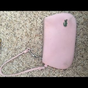 Lacoste wristlet . pink!